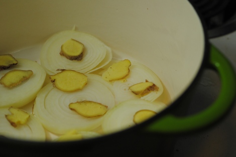 Onion and ginger in the dutch oven for low-amine braised octopus and choy sum (photo)