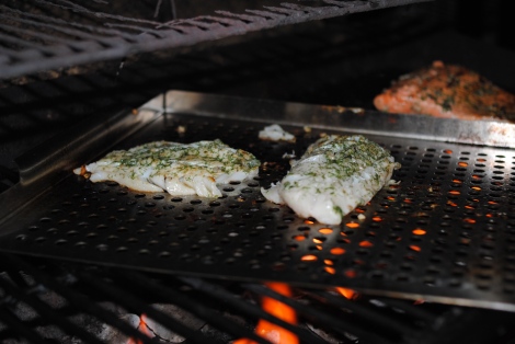 The Grillmaster going to town on grilling cod (low-amine, gluten-free, soy-free, dairy-free, nut-free, paleo) photo